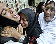 Relatives of Ghadir Mukhaimar grieve at her funeral