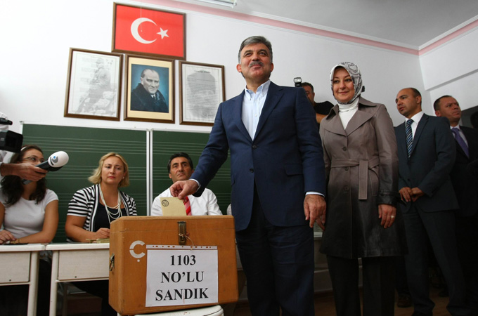 Turkey''s President Abdullah Gul casts his vote during a