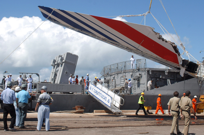 Military officials unload a 14-metre section of Air France’s Airbus A330 plane in the city of Recife, Brazil