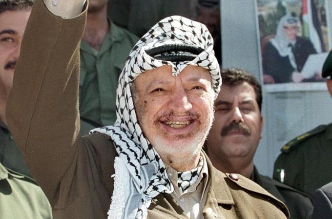 Palestinian leader Yasser Arafat flashes
