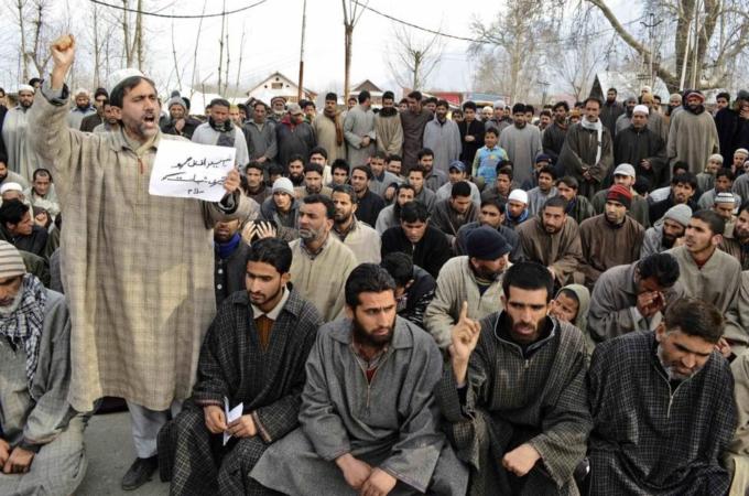 A Kashmiri Muslim shouts slogans during a gathering to offer funeral prayers in absentia for Mohammad Afzal Guru on a road on the outskirts of Srinagar