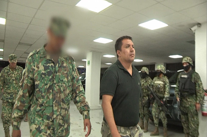 A frame grab taken from a video filmed by the SEMAR of captured Miguel Angel Trevino