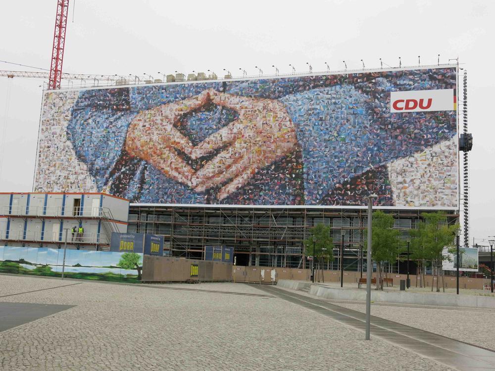 Said to be the largest political advertisement ever in Germany, the chancellor’s hands form her trademark “Merkel rhombus” next to Berlin’s main train station.