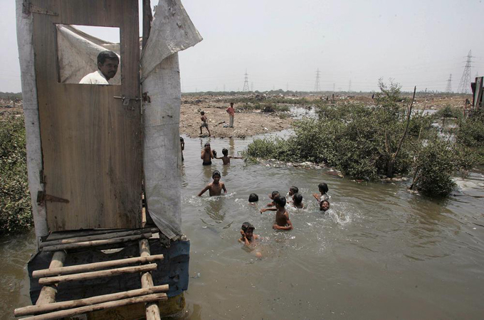 One-third of village households have toilets, while cities suffer poor sanitation and disposal mechanisms [AFP]