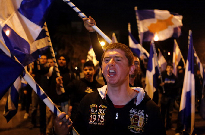 Members of the nationalist Elam party shout slogans and wave flags during a March protest [Getty Images]