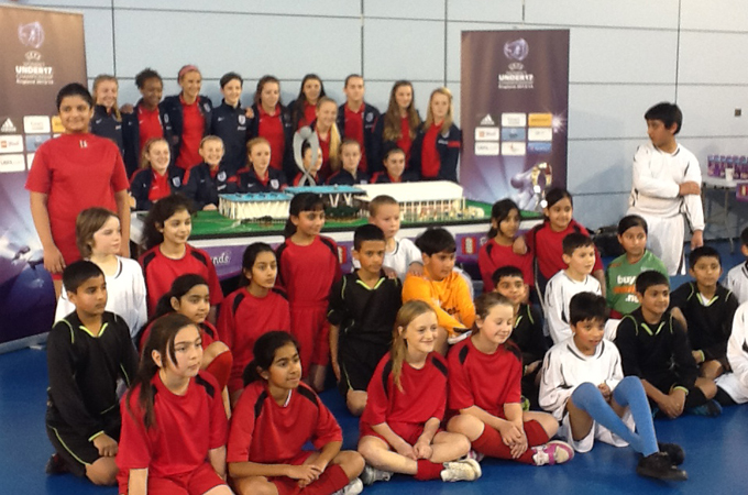A school group meets the England women's under-17 team [Al Jazeera]