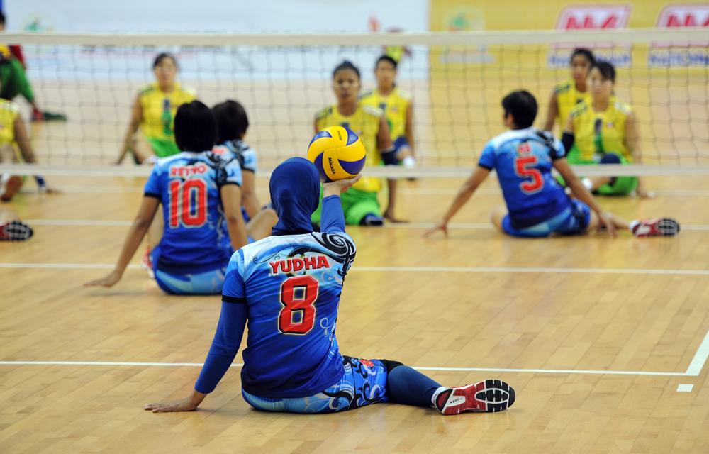 <p class="MsoNoSpacing">An Indonesia women(***)s sitting volleyball team member serves to Myanmar(***)s team in the finals.</p>