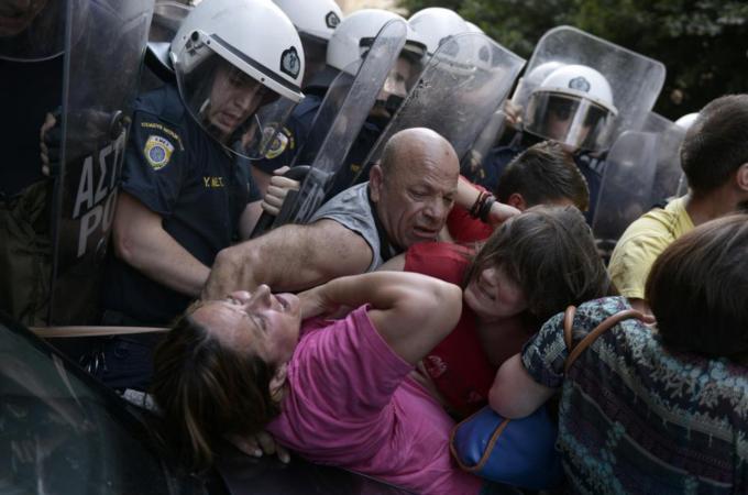 The protesting cleaners have faced violence from the police, writes Tsimitakis [AFP/Getty Images]
