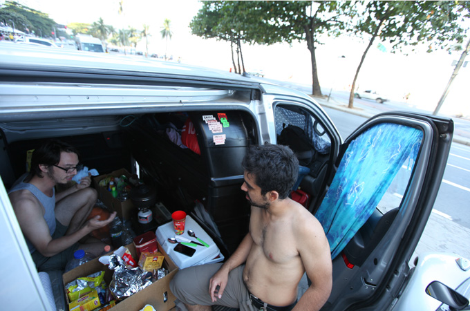 Chile football fans Pablo and Marcelo camp out on Rio de Janeiro's Copacabana Beach [Al Jazeera]