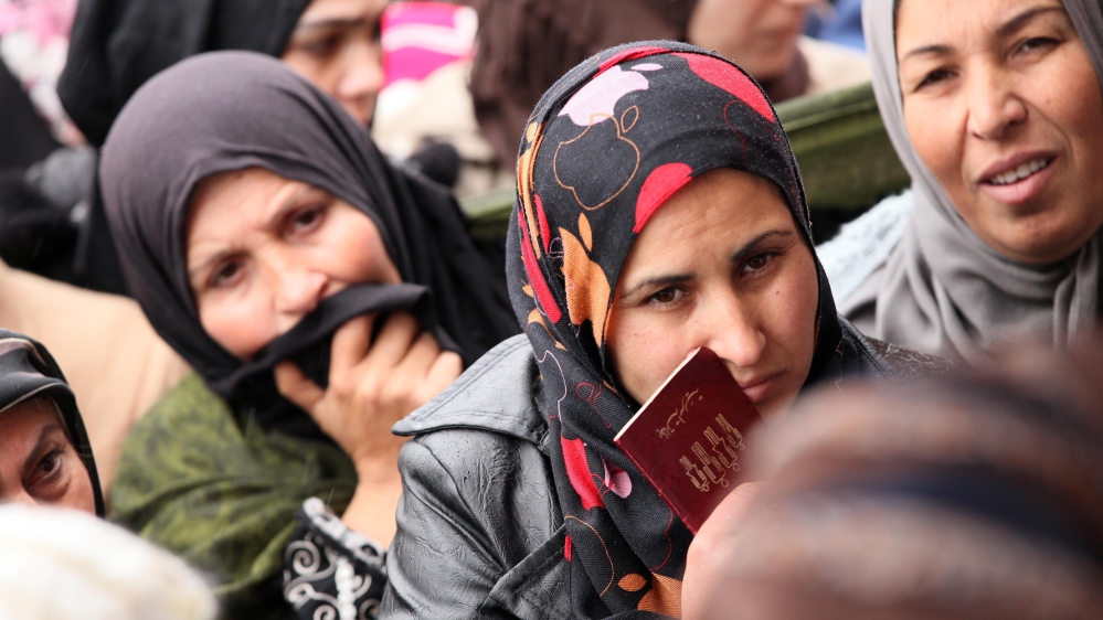 Syrian refugees in Lebanon receive food aid from the Turkish Cooperation and Coordination Agency