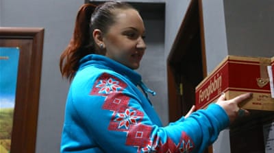 Phoenix Wings coordinator Antonina Buzilio stacks donated medical equipment [Philippa H Stewart] 