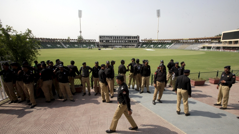 Policemen stand inside the Gaddafi Stadium during preparation ahead of cricket series between Pakistan and Zimbabwe in Lahore