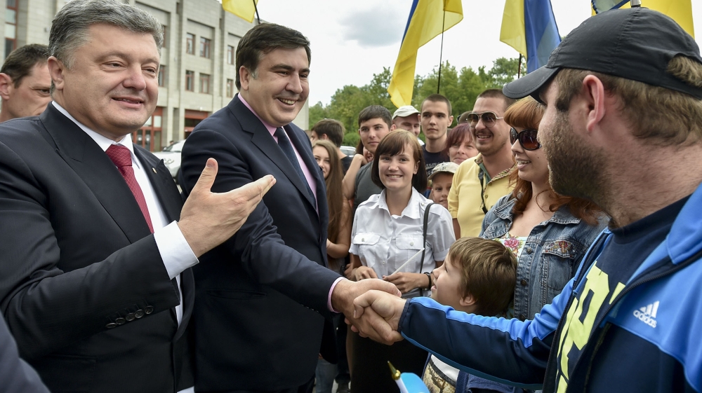 Citizens greet Ukrainian President Petro Poroshenko and Mikhail Saakashvili, newly appointed governor of Odessa region, in Odessa, Ukraine [AP]