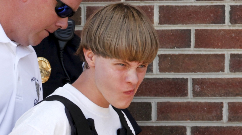 Roof was detained during a traffic stop about three-hours drive away in North Carolina on Thursday [Reuters]