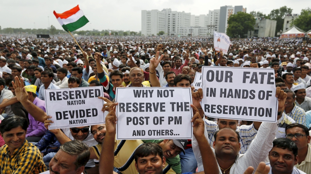 As many as 100 buses were torched and property damaged in the violence in Ahmedabad, Surat, and Mehsana cities and the towns of Unjha and Visnagar [Reuters]