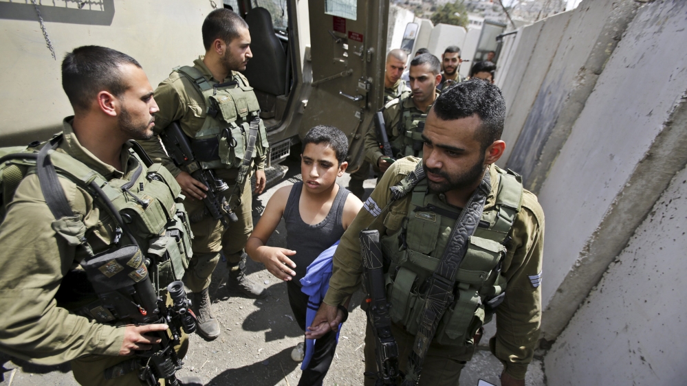 Israeli soldiers detain young Palestinians as unrest continues