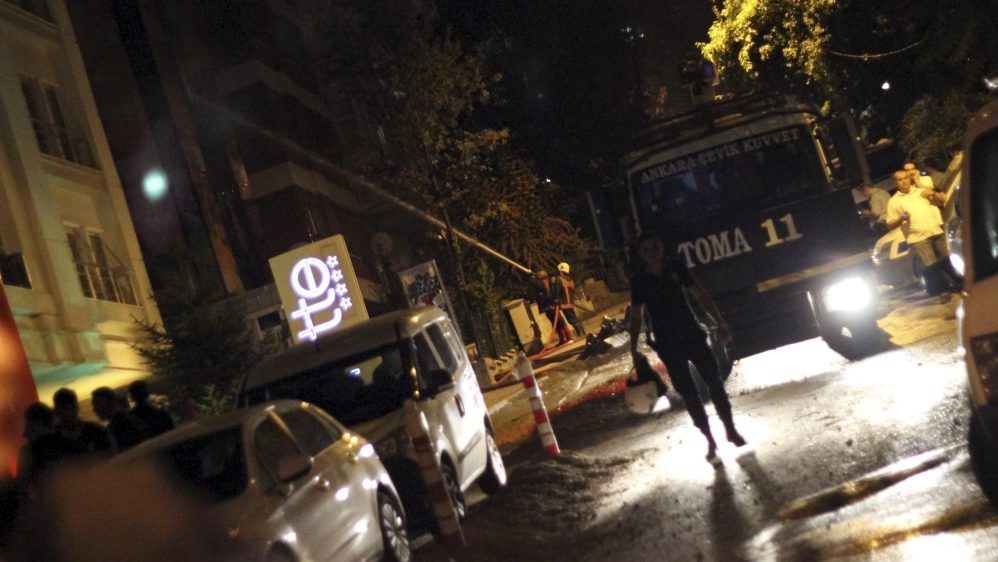 Firefighters work to extinguish a fire at the pro-Kurdish Peoples'' Democratic Party''s headquarters in Ankara, Turkey
