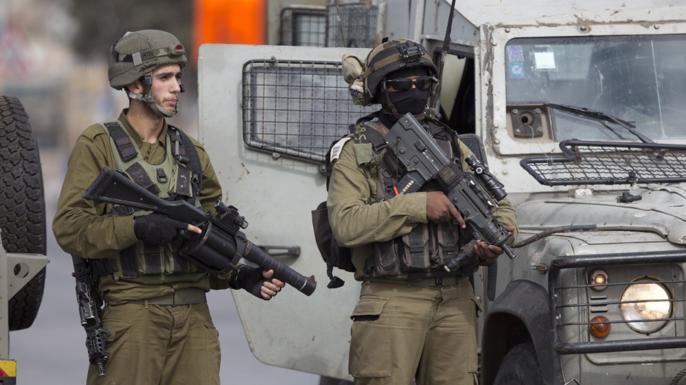 Israeli security forces stand guard at the Jalama checkpoint near Jenin