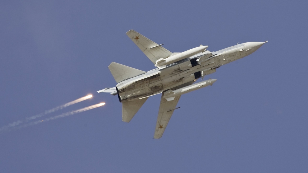 File picture of a Sukhoi Su-24 jet fighter dropping flares during a joint Kazakh-Russian military exercise at Otar military range, west of Almaty
