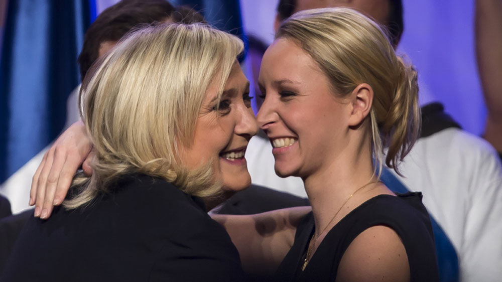 Leader of the French far-right political party, National Front, Marine Le Pen (L), and candidate for the Northern Nord-Pas-de-Calais Picardie region embraces Marion Marechal-Le Pen, candidate for the Provence-Alpes-Cote d'Azur (PACA) region.