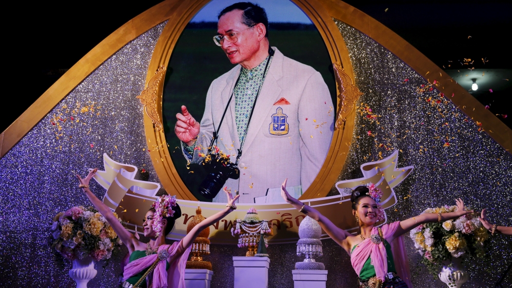 Traditional dancers perform on stage to celebrate Thailand''s King Bhumibol Adulyadej''s 88th birthday in front of Grand Palace in Bangkok
