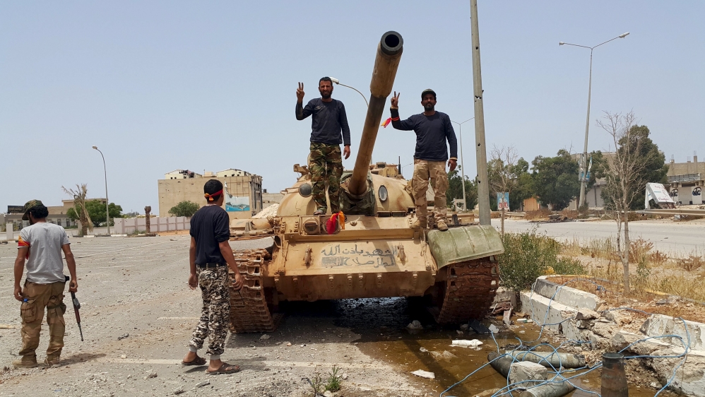  Powerful armed groups on the ground are unlikely to comply with the terms of Thursday's peace deal [Reuters]
