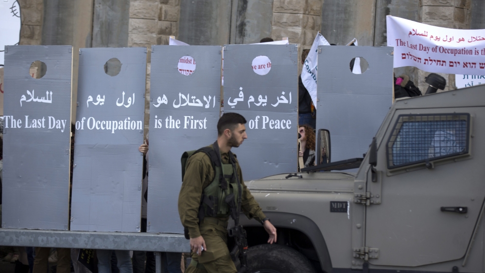 Israeli protest separation wall in Al Khader