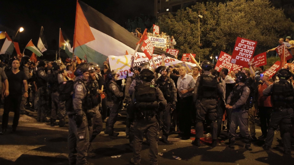 Arab-Israelis and Israeli left wing activists protest against the Israeli offensive on Gaza, in Haifa