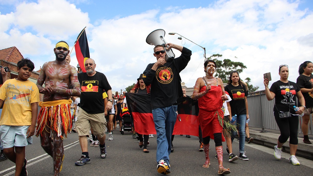  Non-indigenous Australians increasingly shun traditional celebratory barbeques and events of Australia Day to join the protests   [Jarni Blakkarly/Al Jazeera] 
