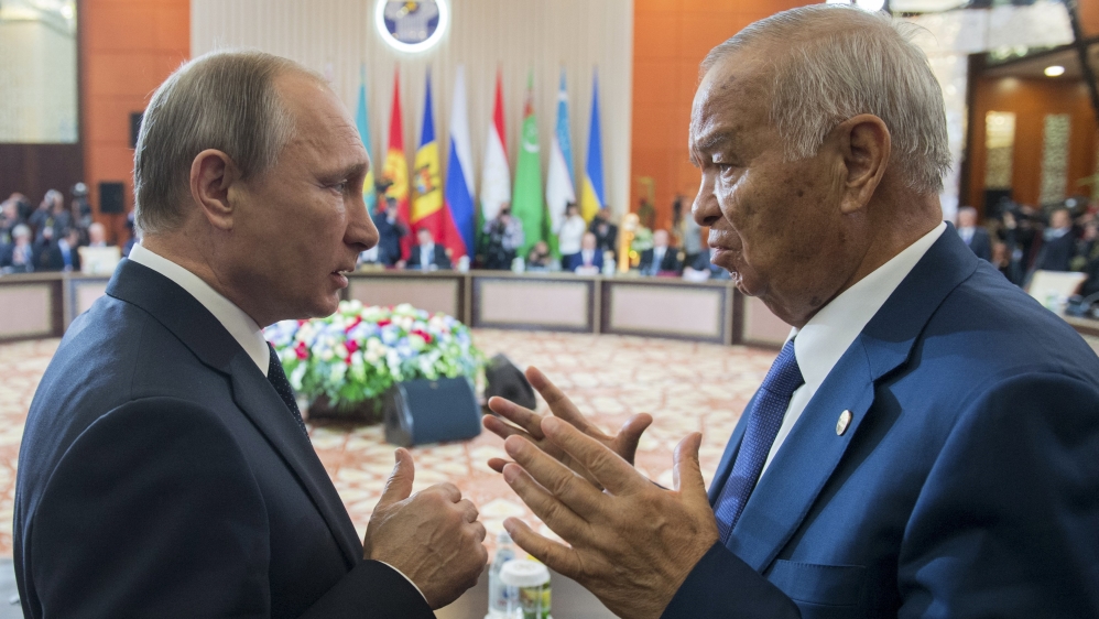 Uzbekistan''s President Karimov talks to Russian President Putin during meeting of ex-Soviet leaders in Burabai