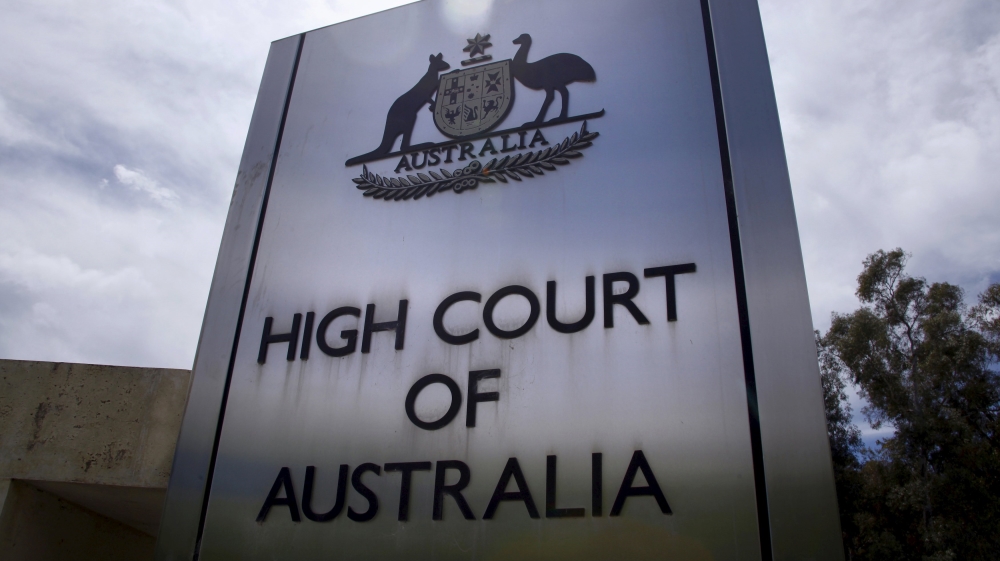 A sign stands outside the High Court of Australia in Canberra, Australia