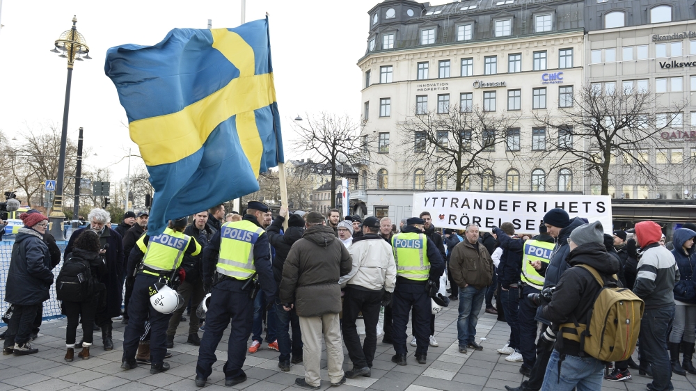 Stockholm Police talk to participants of a movement calling itself "The People''s Demonstration", which held a meeting and demonstration at Norrmalmstorg square in Stockholm