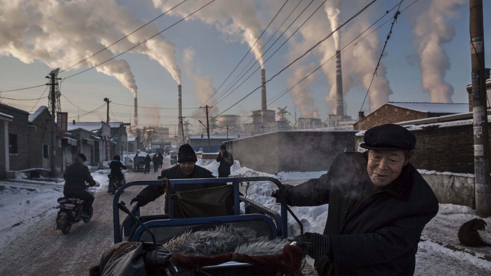 The Paris climate accord aims to keep global warming below 2C [Kevin Frayer/Reuters]