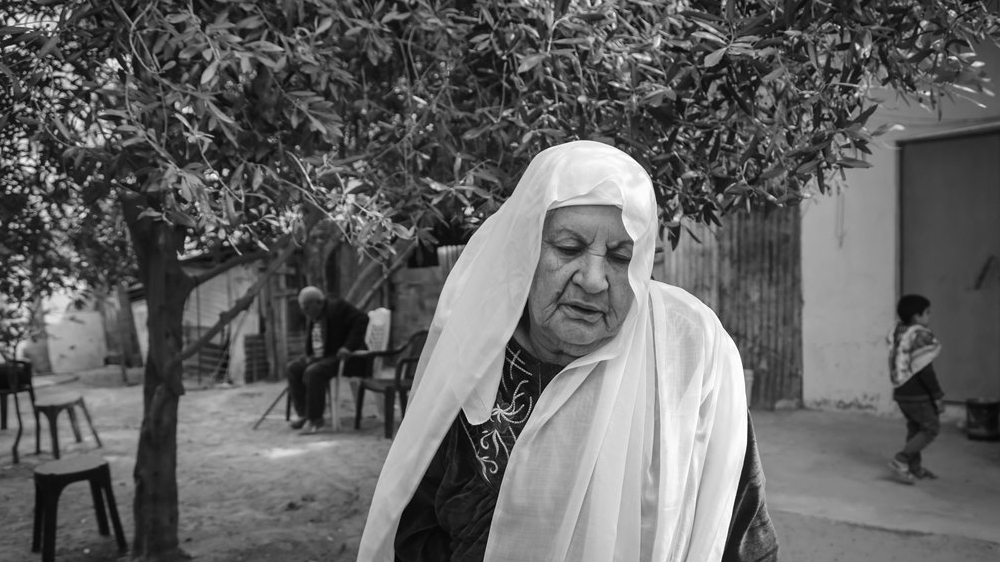 'We never saw another happy day after we left,' says Um Omar [Ezz Zanoun /Al Jazeera]