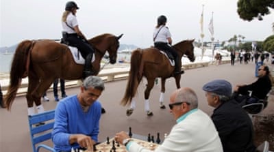 Policewomen on horses patrol on the Croisette near the Festival Palace before the start of the 69th Cannes Film Festival in Cannes [Reuters]