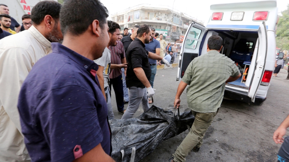 A lorry packed with explosives blew up in a busy shopping street in Karada [EPA]