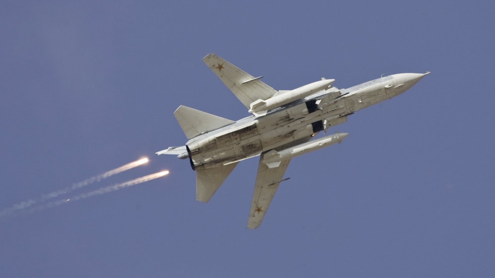 File picture of a Sukhoi Su-24 jet fighter dropping flares during a joint Kazakh-Russian military exercise at Otar military range, west of Almaty