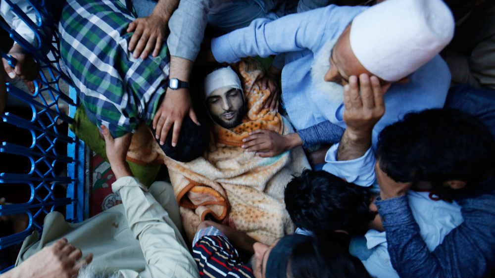 Addressing the mourners, Muzaffar Ahmed Wani, the father of Burhan appealed people not to damage public property. [EPA]