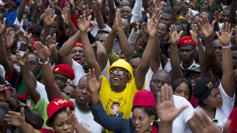 UPND supporters react as presidential candidate Hichilema arrives at a rally in Lusaka