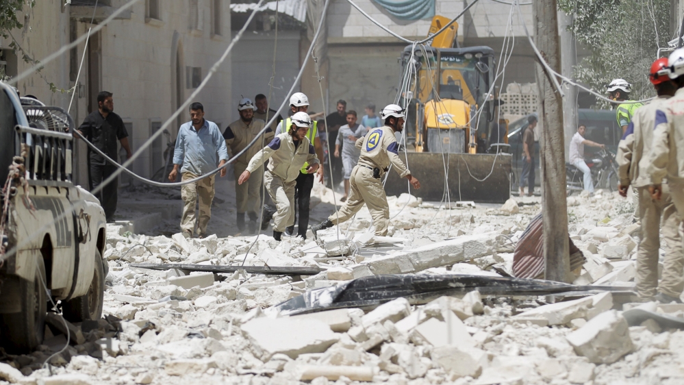 Civil defense members work at a site hit by what activists said was a sea mine dropped by forces loyal to Syria''s President Bashar al-Assad in Maaret al-Naaman town in Idlib province