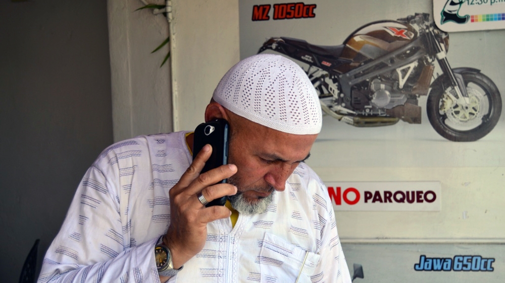 Jorge Miguel Garcia, whose Muslim name is Khaled, runs a cafe with a non-Muslim friend. The cafe is a space where Muslims can get together. He says many non-Muslim customers often end up asking questions about Islam, curious to know more about the religion [Sylvia Hines/Al Jazeera]