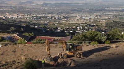 Workers at the place were Federico Garcia Lorca's remains are believed to be as the search of his body starts in Granada, Spain [EPA]
