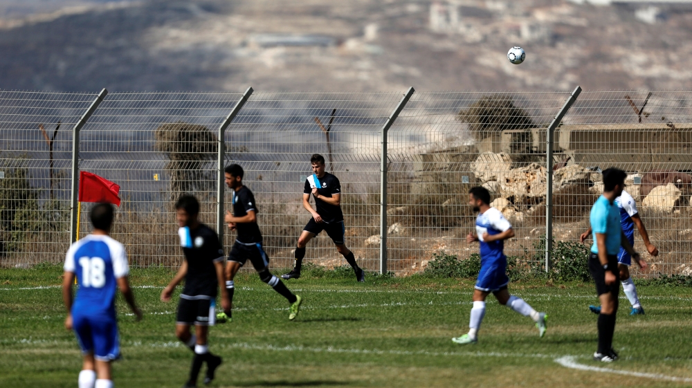 Players on a football field.