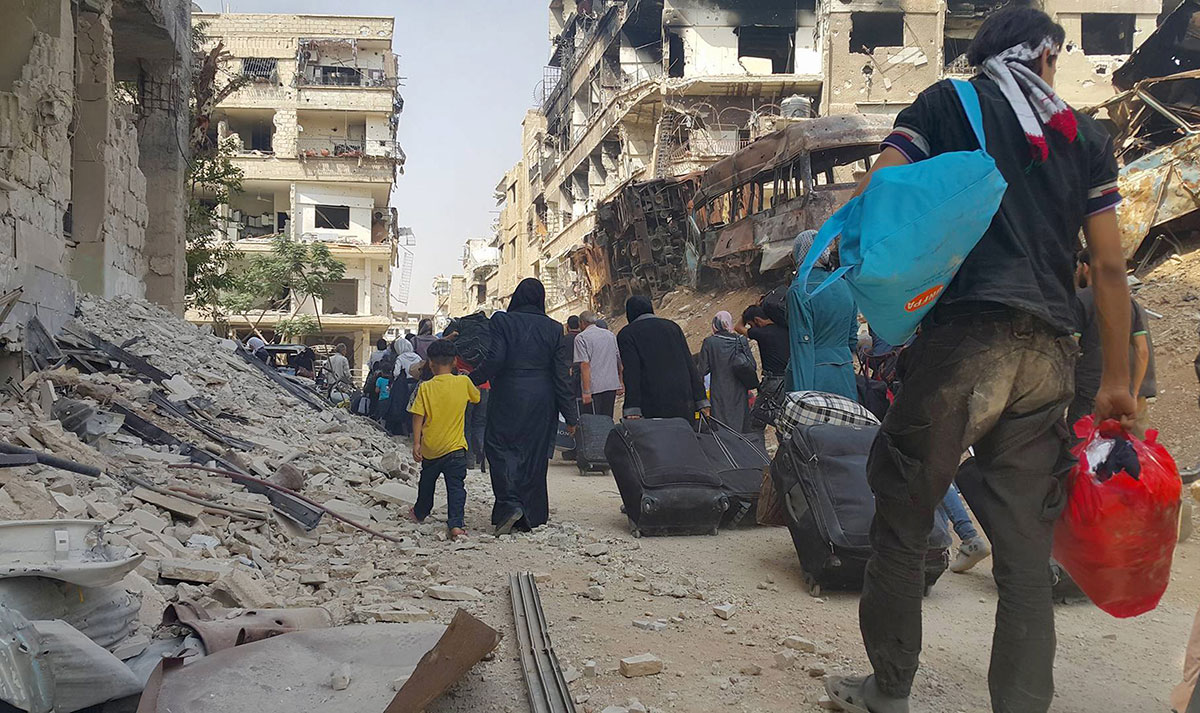 
As the uprising devolved into conflict, Assad began exploiting another popular narrative by presenting himself as the supposed protector of Syria's minorities [Local Council of Daraya City via AP]

