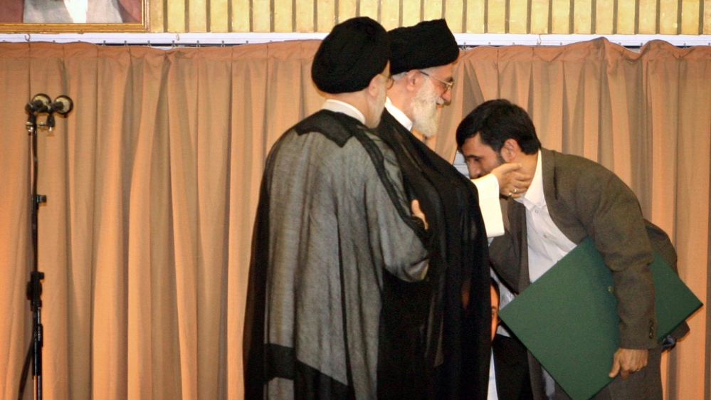 Iranian President Mahmoud Ahmadinejad kisses the hand of Supreme Leader Ayatollah Ali Khamenei