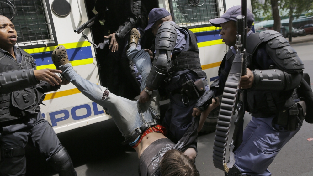 Two arrests were made and minor injuries reported [Kim Ludbrook/EPA]