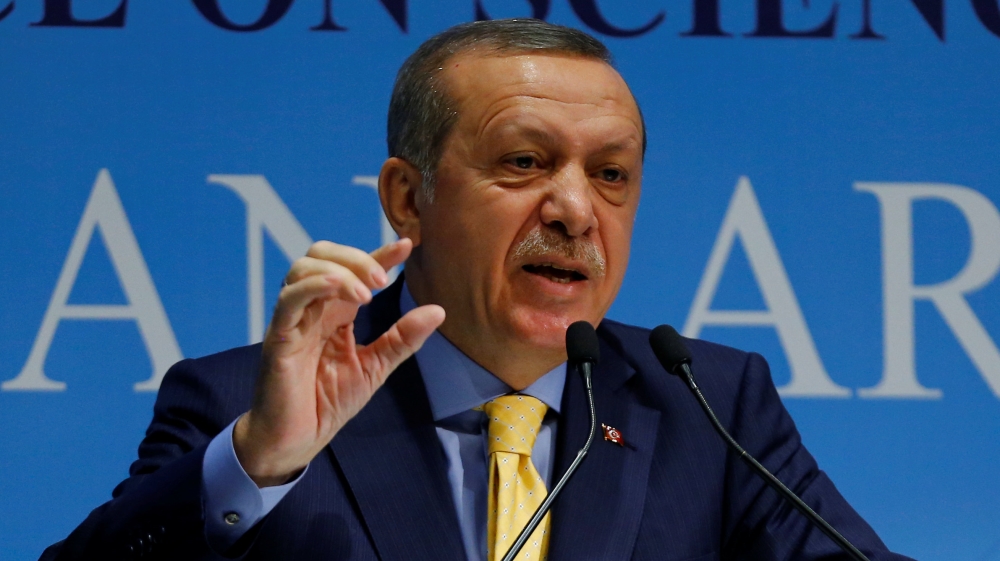Turkish President Erdogan addresses the audience during a meeting in Ankara