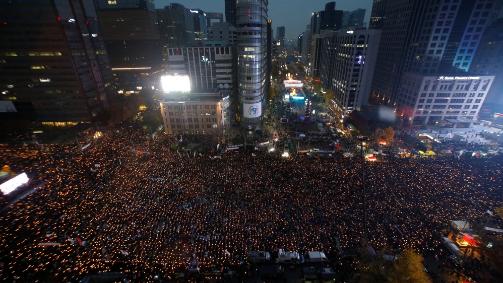 People attend a protest calling South Korean President Park Geun-hye to step down in Seoul