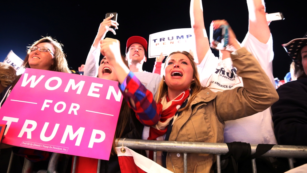 Supporters cheer as Republican presidential nominee Donald Trump speaks at a campaign event in Cedar Rapids