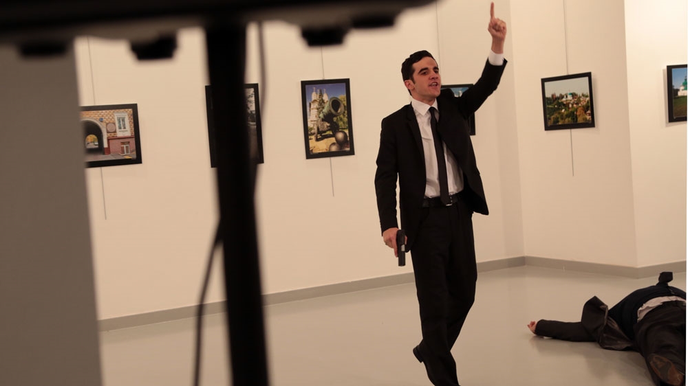 Mevlut Mert Altintas shouted in Turkish 'Don't forget Aleppo! Don't forget Syria!' after killing Karlov [Burhan Ozbilic/AP]